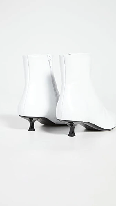 Shop By Far Laura Booties In White