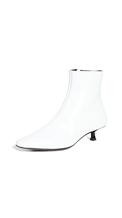 Shop By Far Laura Booties In White