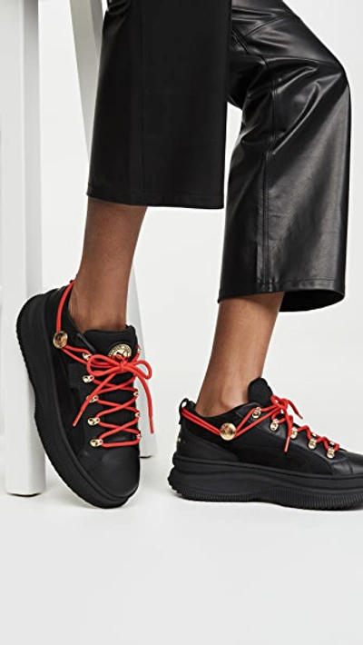 Shop Puma X Balmain Deva Low Sneakers In Black