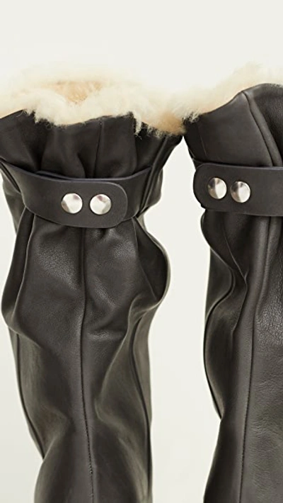 Shop Isabel Marant Lakfee Shearling Wrinkled Boots In Grey
