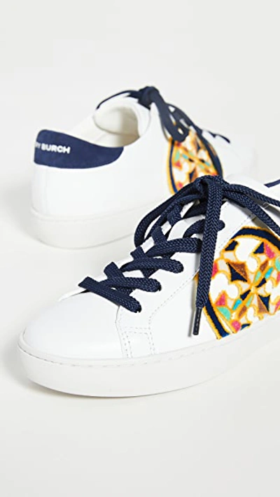 Shop Tory Burch T-logo Fil Coupe Sneakers In White/royal Navy/multi