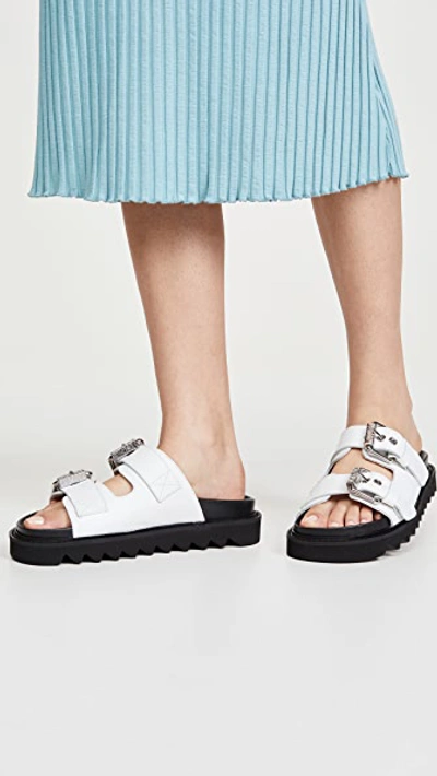 Shop Moschino Slide Double Buckle Sandals In White