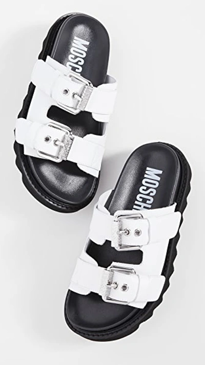 Shop Moschino Slide Double Buckle Sandals In White