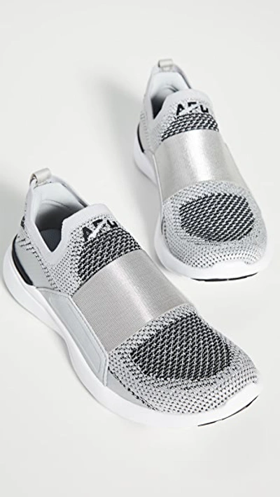 Shop Apl Athletic Propulsion Labs Techloom Bliss Sneakers In Metallic Silver/white/black