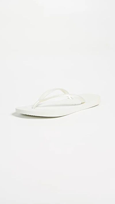 Shop Havaianas Slim Flip Flops In White