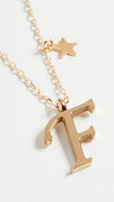 Shop Shashi Letter Pendant With Star Charm In F
