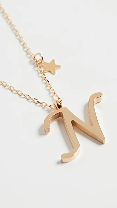 Shop Shashi Letter Pendant With Star Charm In N