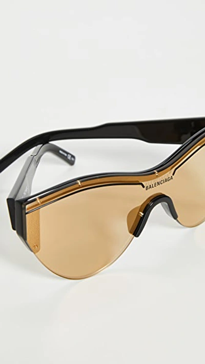 Shop Balenciaga Extreme Cat Eye Ski Goggle Sunglasses In Black/black/gold
