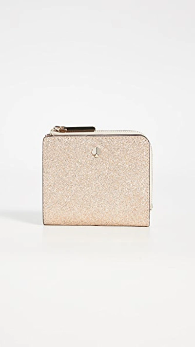 Shop Kate Spade Burgess Court Small Bifold Wallet In Pale Gold