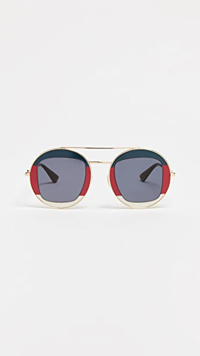 Shop Gucci Urban Round Sunglasses In Navy/red/gold