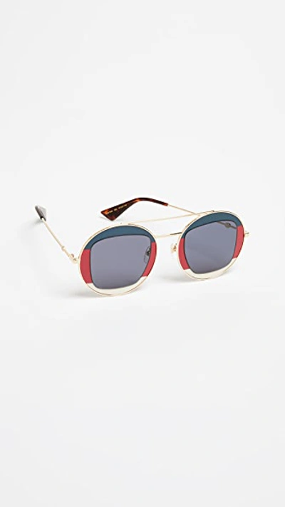 Shop Gucci Urban Round Sunglasses In Navy/red/gold