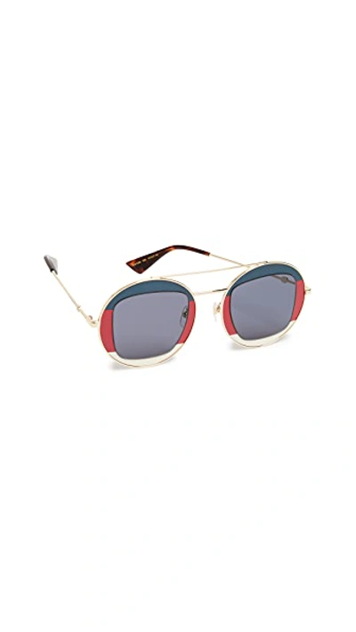 Shop Gucci Urban Round Sunglasses In Navy/red/gold