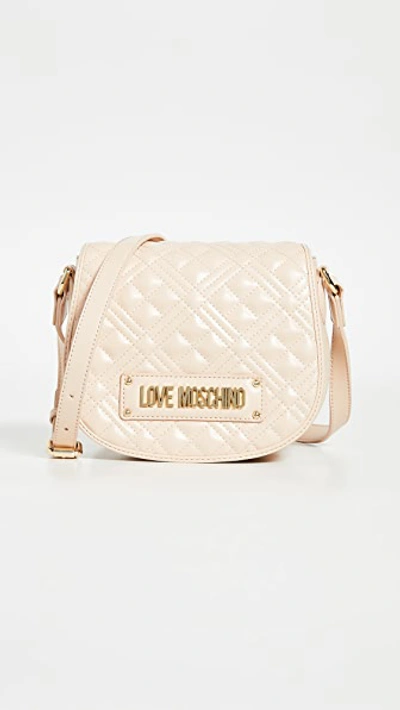 Shop Moschino Quilted Saddle Bag In Natural