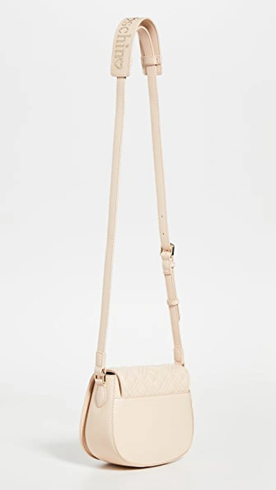 Shop Moschino Quilted Saddle Bag In Natural