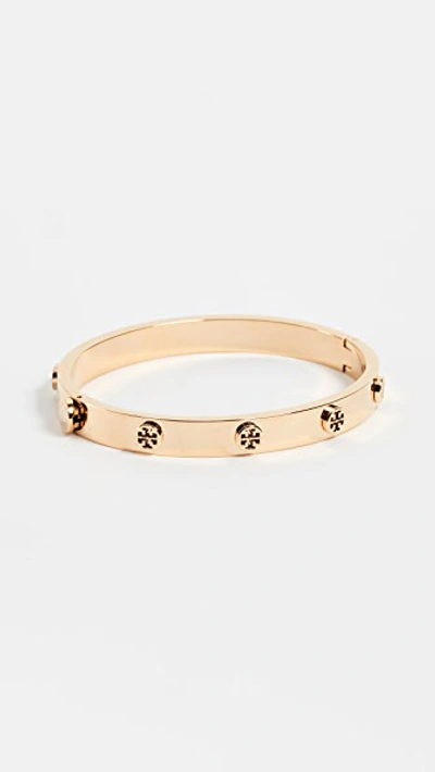 Shop Tory Burch Logo Stud Hinge Bracelet In Tory Gold