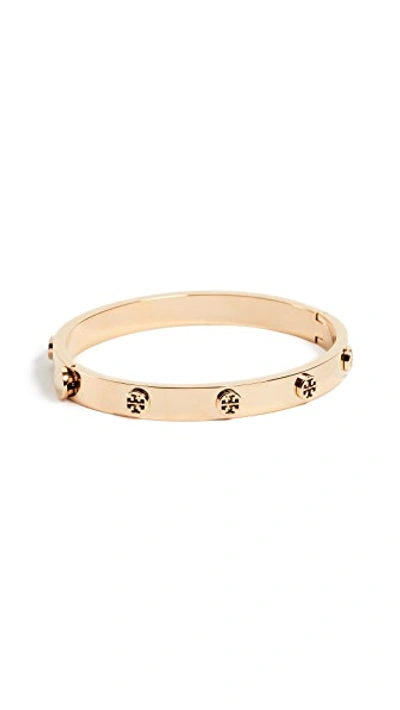 Shop Tory Burch Logo Stud Hinge Bracelet In Tory Gold