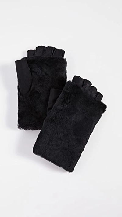 Shop Agnelle Bella Shearling Fingerless Gloves In Black