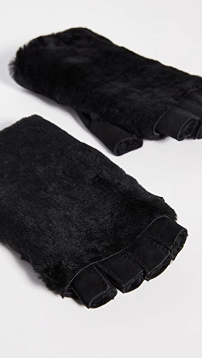 Shop Agnelle Bella Shearling Fingerless Gloves In Black