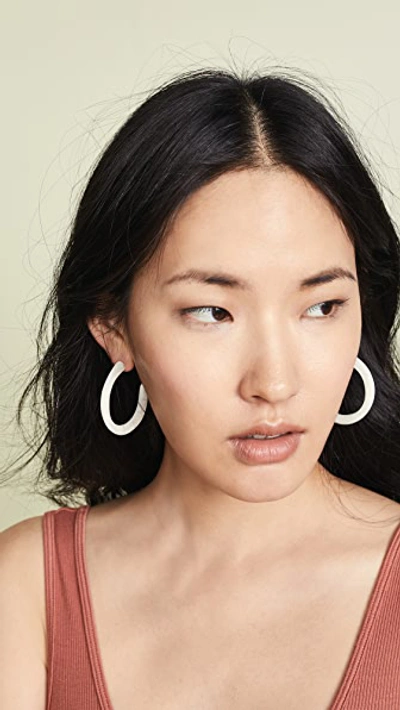 Shop Dinosaur Designs Medium Loop Earrings In Snow Swirl