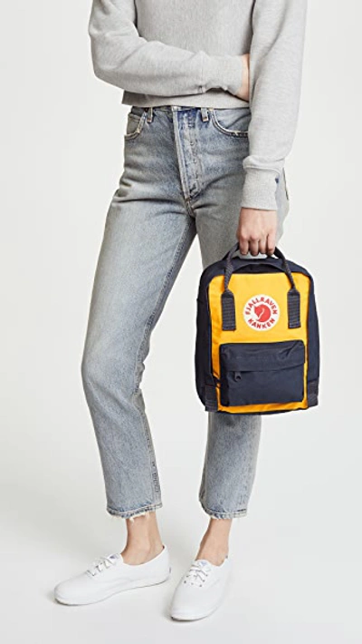 Shop Fjall Raven Kanken Mini Backpack In Navy/warm Yellow