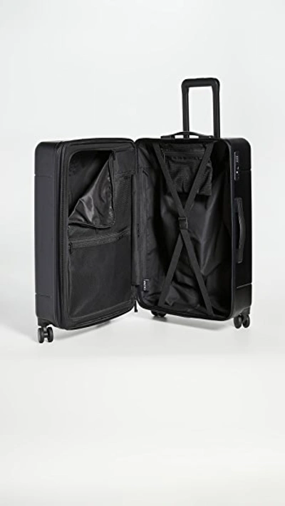Shop Calpak 24" Medium Suitcase In Black