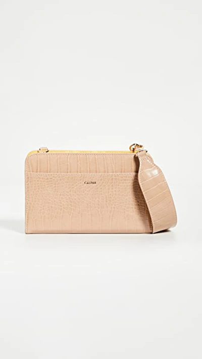 Shop Calpak Croc Travel Wallet In Sand