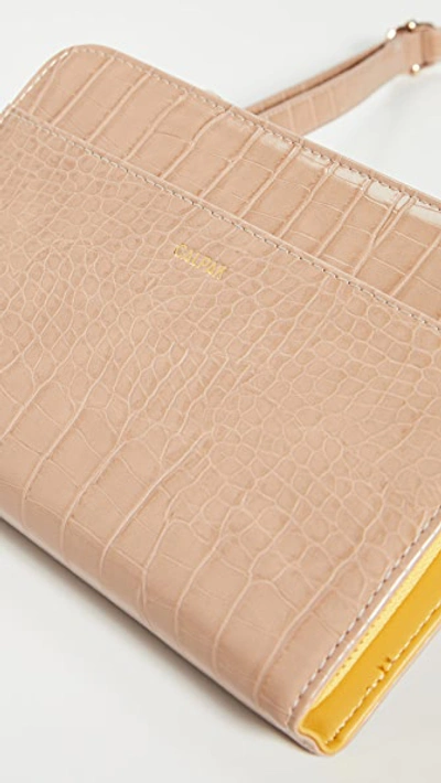 Shop Calpak Croc Travel Wallet In Sand