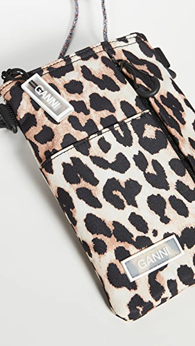 Shop Ganni Multi Pocket Crossbody Bag In Leopard