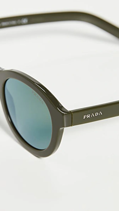 Shop Prada Round Sunglasses In Green/green Mirror