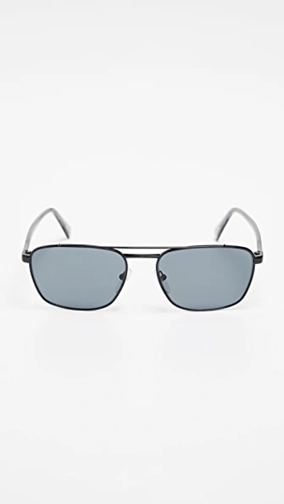 Shop Prada Polarized Sunglasses In Black/polar Grey