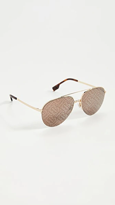 Shop Burberry Ferry Sunglasses In Gold/brown Tampo Tb