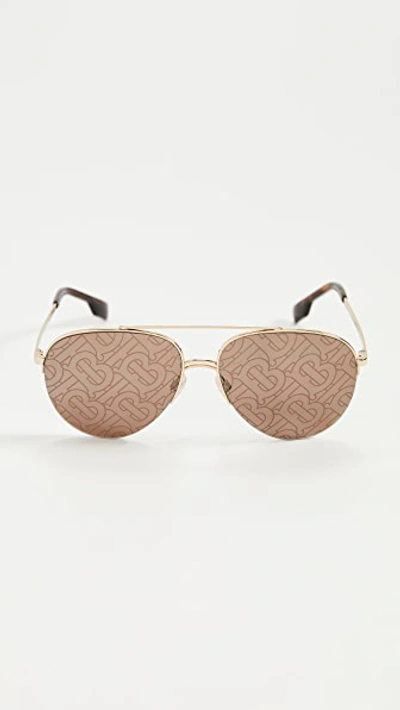 Shop Burberry Ferry Sunglasses In Gold/brown Tampo Tb