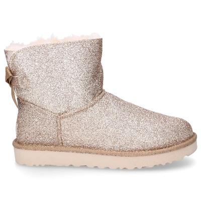 Ugg Mini Bailey Bow Glitter Ankle Boots In Gold | ModeSens