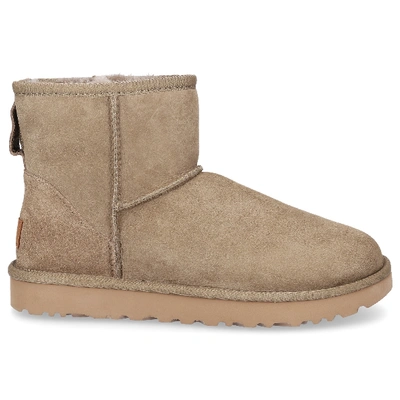 Shop Ugg Snowboots Classic Mini Ii  Lambskin  Logo Olive