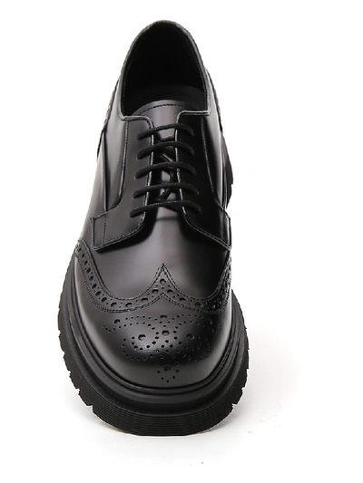 Shop Prada Logo Embossed Derby Brogues In Black