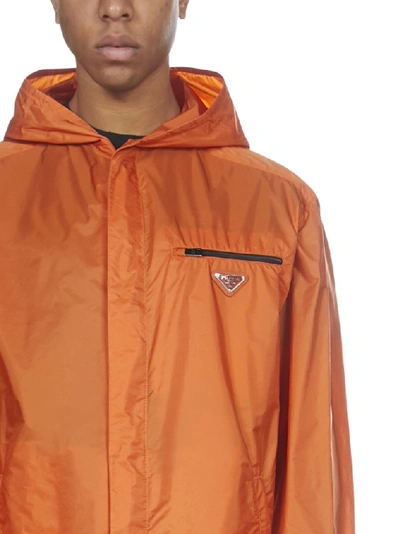 Shop Prada Logo Plaque Raincoat In Orange