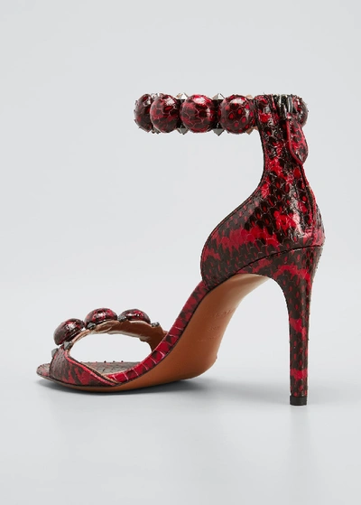 Shop Alaïa Bombe Stud Snakeskin Ankle-wrap Sandals In Red