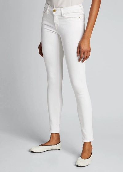 Shop Frame Le Color Mid-rise Skinny Jeans In White