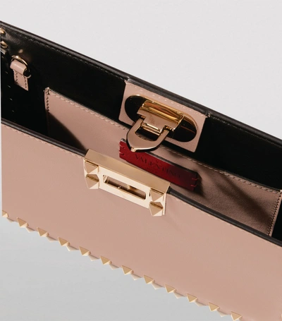 Shop Valentino Garavani Leather Rockstud Clutch Bag