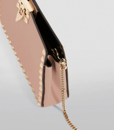 Shop Valentino Garavani Leather Rockstud Clutch Bag