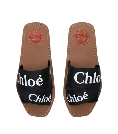Shop Chloé Woody Logo Slides In Black