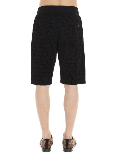 Shop Dolce & Gabbana All Over Logo Bermuda Shorts In Black