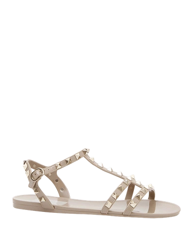 Shop Valentino Rockstud Jelly Flat Gladiator Sandals In Poudre