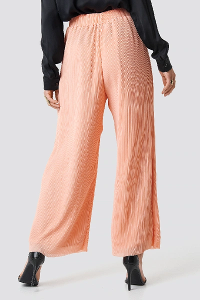 Shop Glamorous High Waist Wide Trousers Pink In Peach Plisse