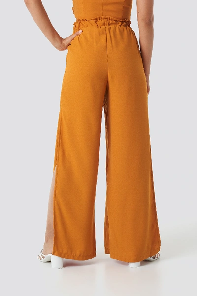 Shop Adorable Caro X Na-kd Side Slit Wide Pants - Orange