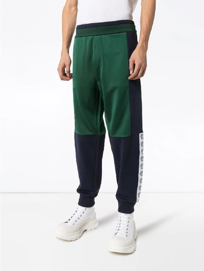 Shop Versace Print Tracksuit Trousers In Green