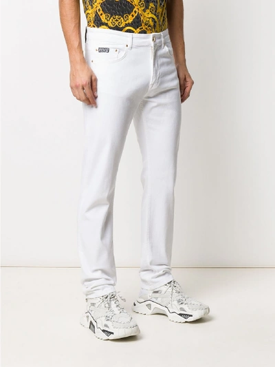 Shop Versace Jeans Couture Slim Jeans In White