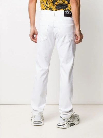 Shop Versace Jeans Couture Slim Jeans In White