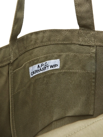 Commonwealth PH - The Alan Tote Bag in Khaki by Carhartt WIP x A.P.C.  features a large contrasting Carhartt x A.P.C. logo on cotton twill, and is  meant to be carried on