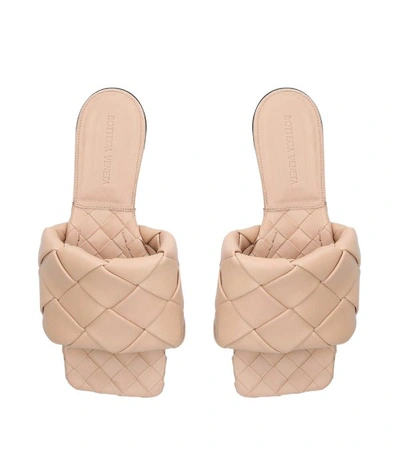 Shop Bottega Veneta Leather Intrecciato Slides